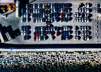 Aerial view of used cars lined up in the port