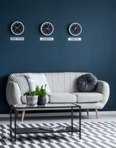 time zones clocks above sofa e1617098208890